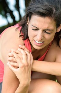 woman with an injured shoulder